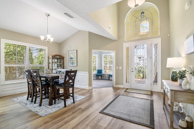 1125 S Marsh Wind Way, Ponte Vedra Beach, FL 32082 - foyer entrance featuring a notable chandelier, a wealth of natural light, visible vents, and wood finished floors