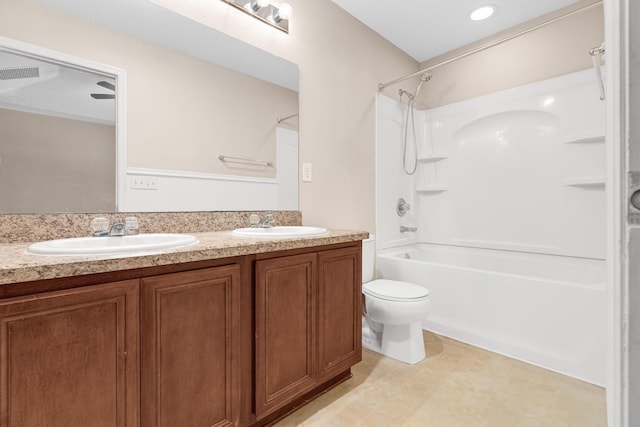 full bathroom featuring shower / tub combination, vanity, and toilet