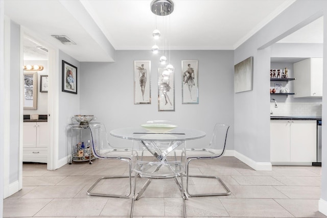 317 Flagler Blvd Unit 3A, Saint Augustine, FL 32080 - dining space featuring light tile patterned floors and ornamental molding