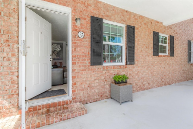 317 Flagler Blvd Unit 3A, Saint Augustine, FL 32080 - doorway to property featuring brick siding and a porch