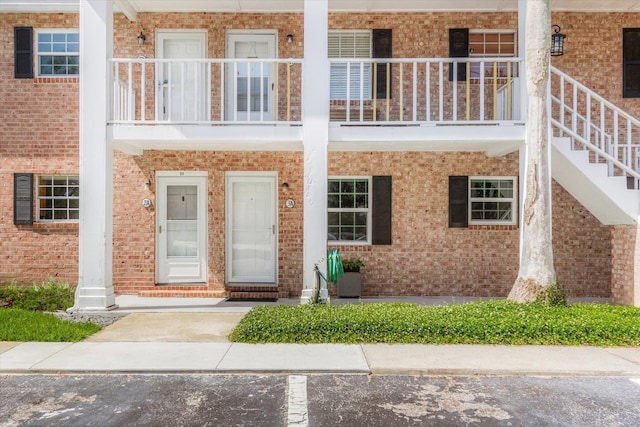 317 Flagler Blvd Unit 3A, Saint Augustine, FL 32080 - doorway to property with brick siding, a balcony, and covered porch