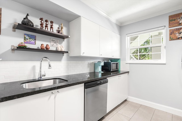 317 Flagler Blvd Unit 3A, Saint Augustine, FL 32080 - kitchen with appliances with stainless steel finishes, crown molding, backsplash, white cabinets, and dark stone countertops