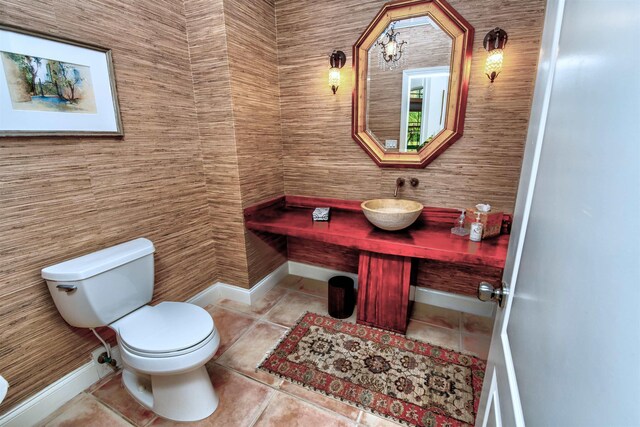 413 Fiddlers Point Dr, Saint Augustine, FL 32080 - half bathroom featuring tile patterned floors, toilet, and a sink