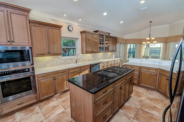 413 Fiddlers Point Dr, Saint Augustine, FL 32080 - kitchen with black appliances, a sink, lofted ceiling, healthy amount of natural light, and decorative backsplash