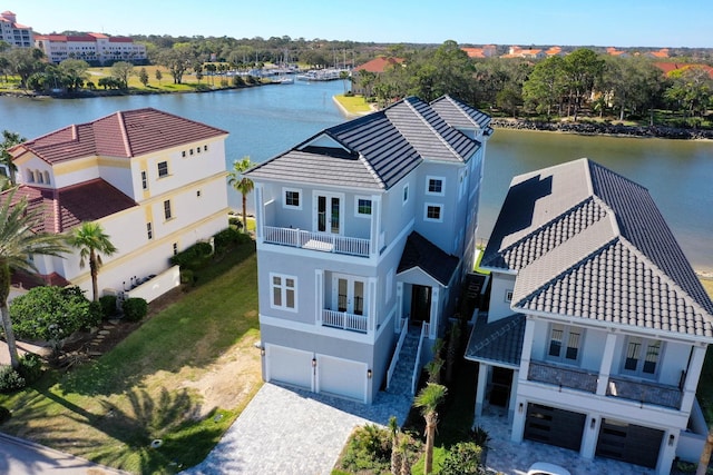 birds eye view of property with a water view