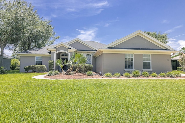 single story home featuring a front lawn