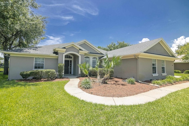 single story home featuring a front yard