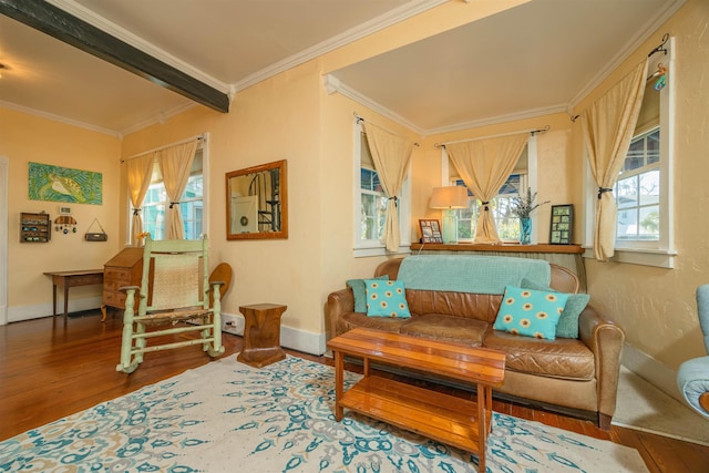 living area with hardwood / wood-style flooring, crown molding, and plenty of natural light