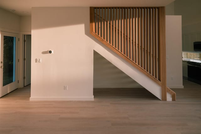 51 Hernandez Ave, Palm Coast, FL 32137 - staircase featuring wood finished floors and baseboards