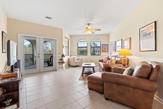 living room featuring french doors, ceiling fan, and light tile patterned flooring