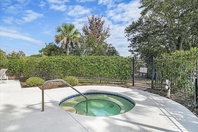 view of swimming pool with an in ground hot tub and a patio