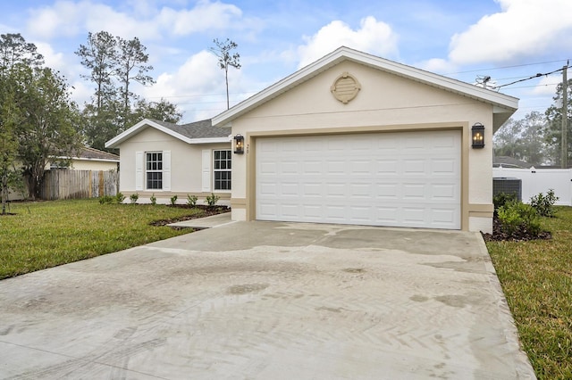 single story home featuring a garage and a front yard