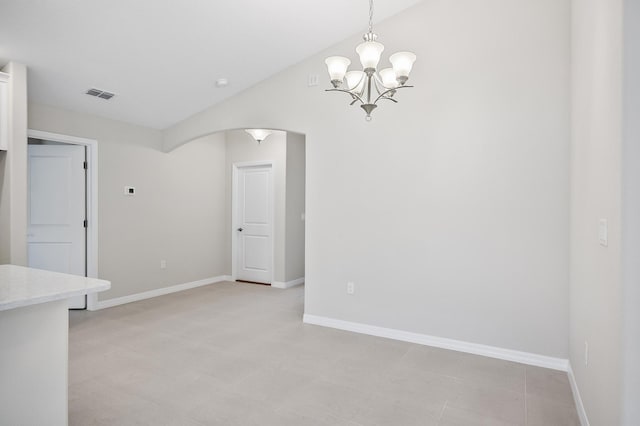 interior space with lofted ceiling and a chandelier