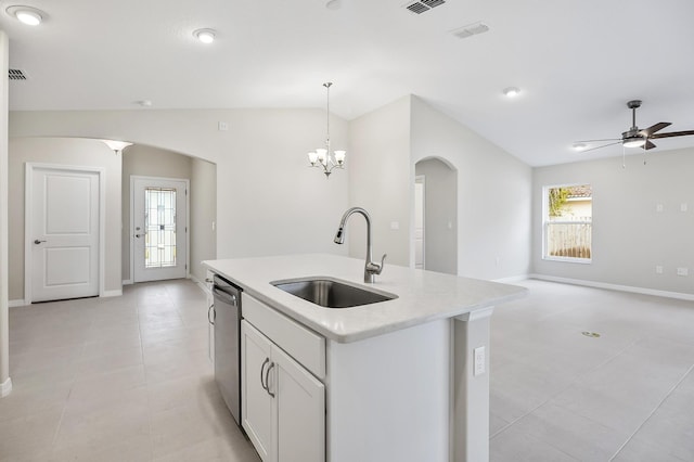 kitchen featuring sink, white cabinetry, hanging light fixtures, dishwasher, and a kitchen island with sink