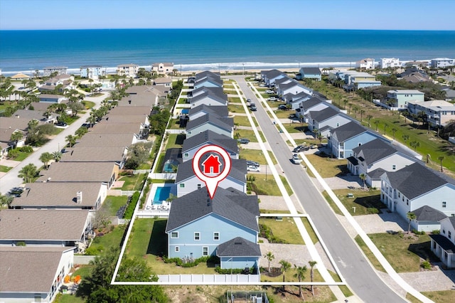 bird's eye view featuring a water view and a residential view