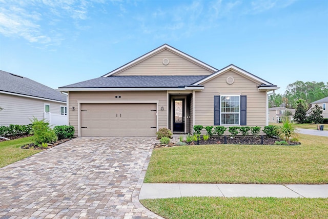 ranch-style home featuring a garage and a front lawn