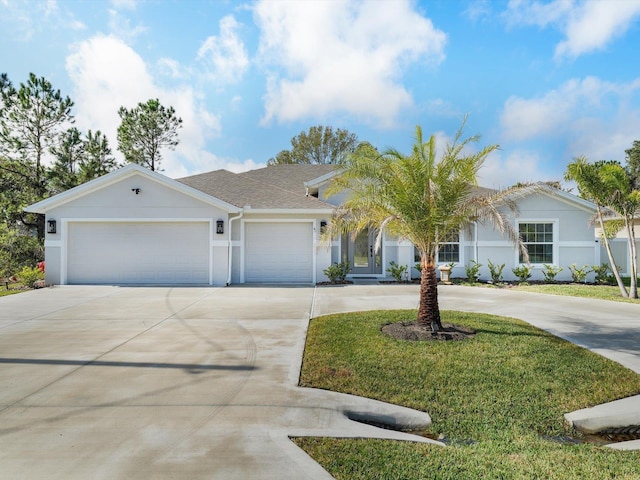 view of front of home featuring a garage and a front lawn