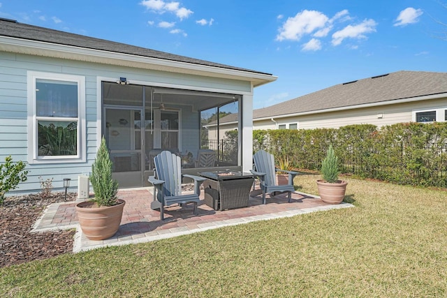 exterior space with a fire pit, a sunroom, and fence