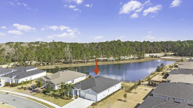 drone / aerial view featuring a residential view and a water view