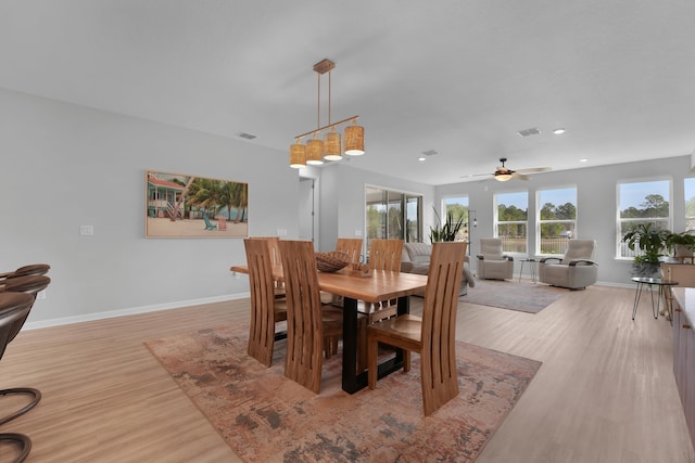 dining space with light wood-type flooring, visible vents, baseboards, and recessed lighting