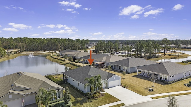 birds eye view of property featuring a residential view and a water view