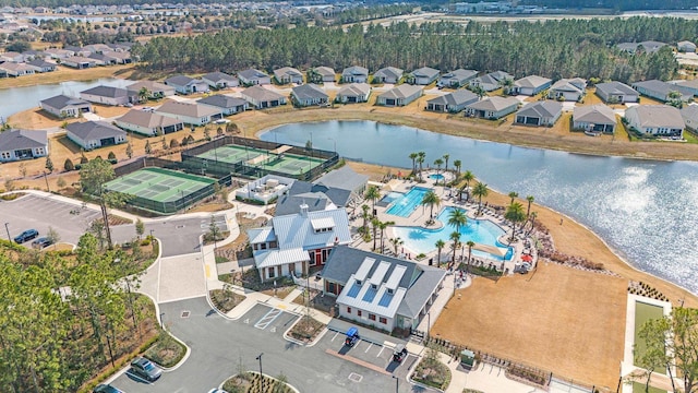 bird's eye view with a water view and a residential view