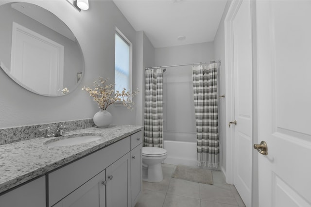 bathroom featuring tile patterned floors, shower / bath combo with shower curtain, toilet, and vanity