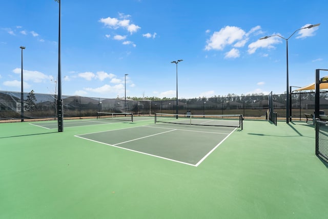 view of sport court with fence