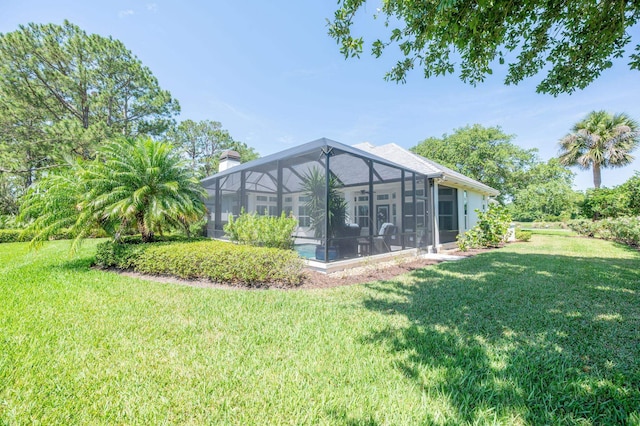 248 Marshside Dr, Saint Augustine, FL 32080 - view of grassy yard with a lanai