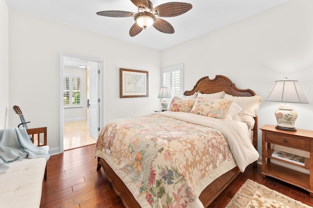 248 Marshside Dr, Saint Augustine, FL 32080 - bedroom with dark wood-type flooring, multiple windows, baseboards, and ceiling fan