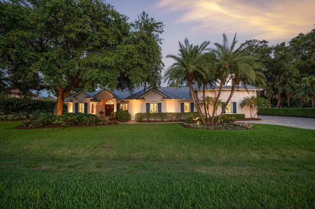 248 Marshside Dr, Saint Augustine, FL 32080 - ranch-style home featuring stucco siding, driveway, and a lawn