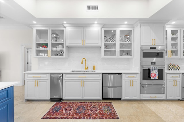 248 Marshside Dr, Saint Augustine, FL 32080 - kitchen featuring a warming drawer, a sink, appliances with stainless steel finishes, tasteful backsplash, and light countertops