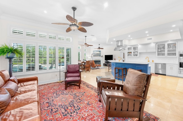 248 Marshside Dr, Saint Augustine, FL 32080 - living room with ceiling fan, ornamental molding, a fireplace, recessed lighting, and light tile patterned floors