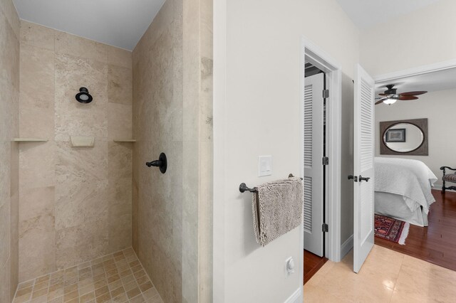 248 Marshside Dr, Saint Augustine, FL 32080 - ensuite bathroom with tiled shower, a ceiling fan, and tile patterned floors