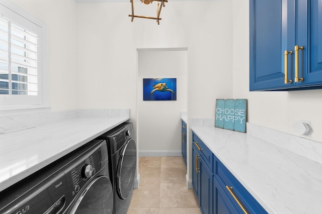248 Marshside Dr, Saint Augustine, FL 32080 - laundry room featuring independent washer and dryer, cabinet space, light tile patterned floors, a chandelier, and baseboards