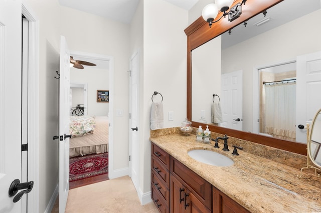 248 Marshside Dr, Saint Augustine, FL 32080 - bathroom with connected bathroom, vanity, baseboards, a ceiling fan, and a shower with shower curtain