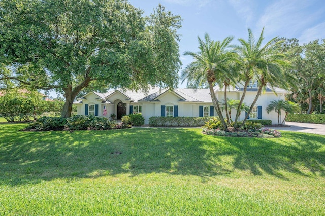 248 Marshside Dr, Saint Augustine, FL 32080 - ranch-style home with driveway, stucco siding, an attached garage, and a front lawn
