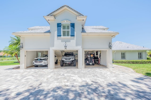 248 Marshside Dr, Saint Augustine, FL 32080 - view of front facade with decorative driveway and stucco siding