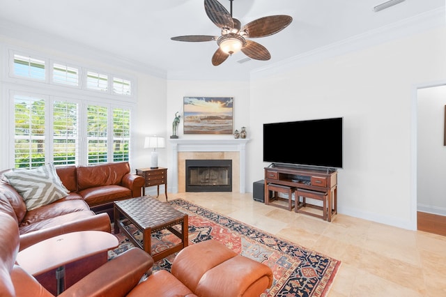 248 Marshside Dr, Saint Augustine, FL 32080 - living room with a ceiling fan, ornamental molding, a fireplace, baseboards, and light tile patterned flooring