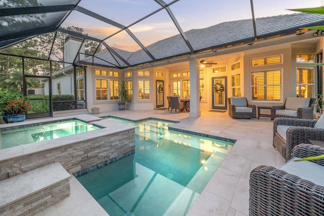 248 Marshside Dr, Saint Augustine, FL 32080 - pool at dusk featuring an outdoor pool, an in-ground hot tub, a patio area, and outdoor lounge area