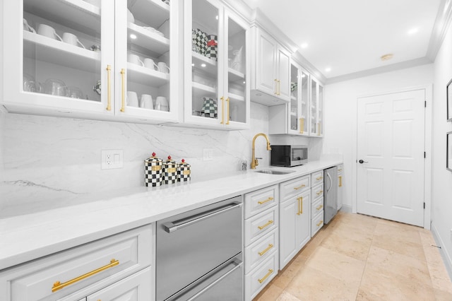 248 Marshside Dr, Saint Augustine, FL 32080 - kitchen with a sink, backsplash, stainless steel appliances, white cabinets, and light countertops