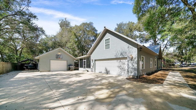 view of side of property with a garage