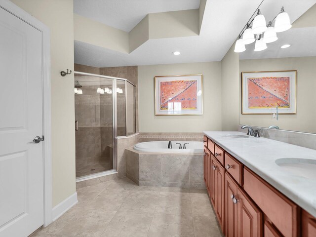 full bath featuring a bath, a shower stall, and a sink