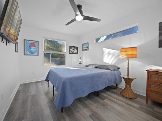 bedroom with hardwood / wood-style flooring and ceiling fan