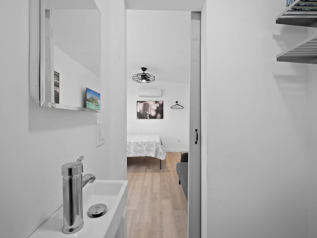 bathroom with hardwood / wood-style floors