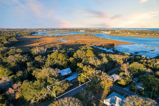 aerial view at dusk with a water view