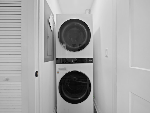 laundry room with stacked washer and clothes dryer