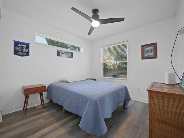 bedroom with ceiling fan and dark hardwood / wood-style floors