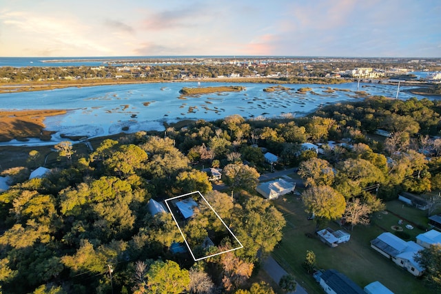 aerial view at dusk with a water view