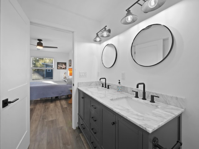 bathroom with vanity, hardwood / wood-style floors, and ceiling fan